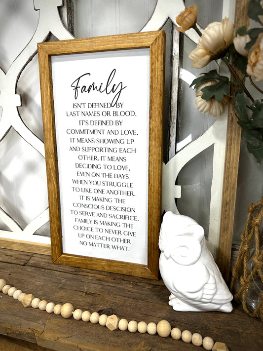 Family isn’t defined only by last name wood framed canvas print