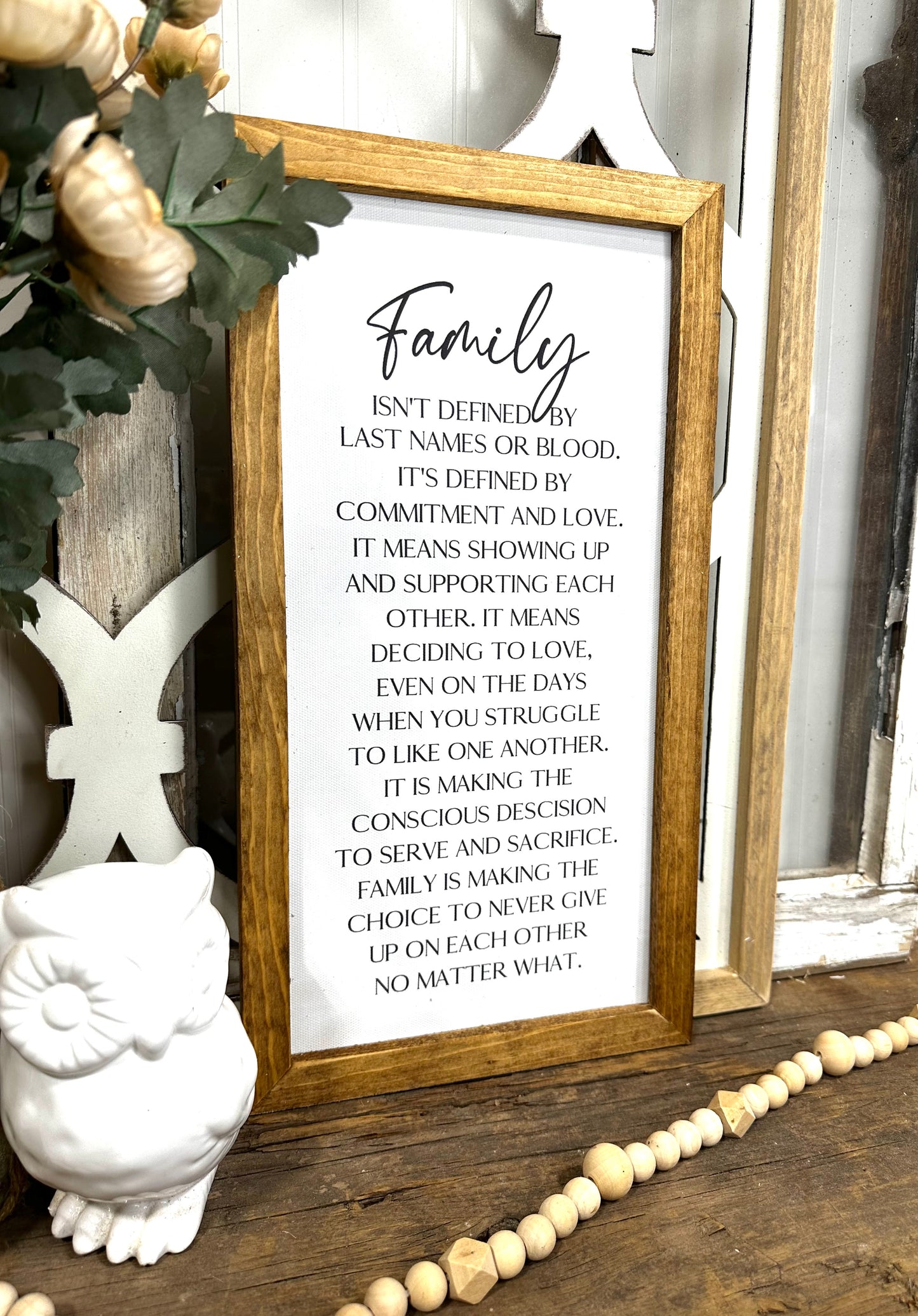 Family isn’t defined only by last name wood framed canvas print