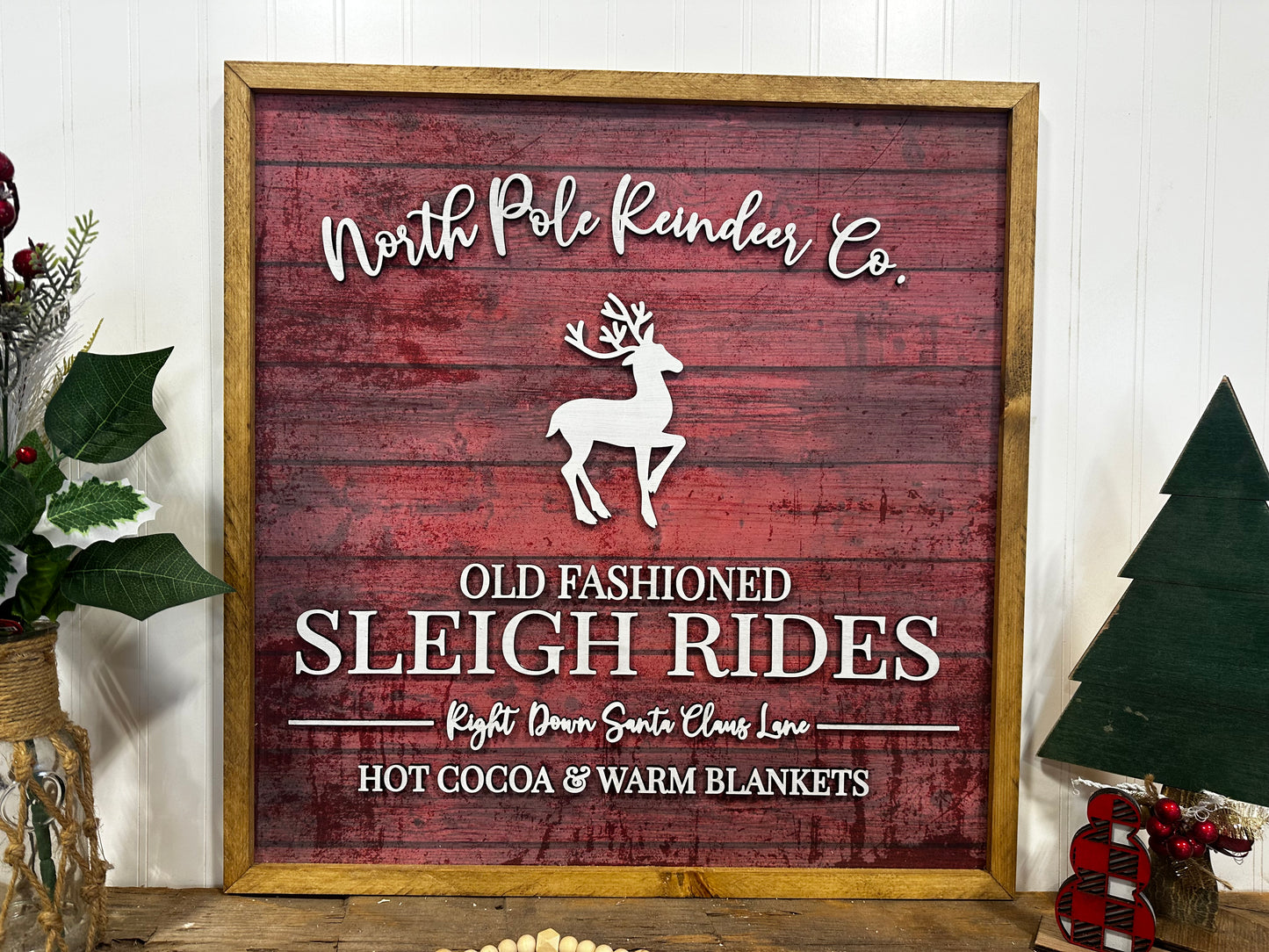 North Pole Reindeer Co wood framed sign