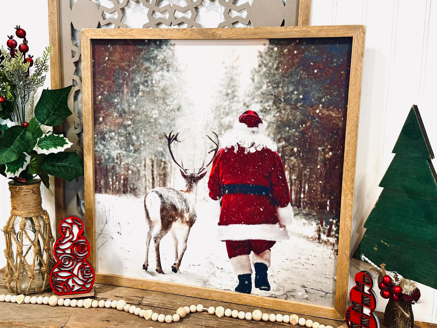 Santa walking with reindeer wood framed canvas print