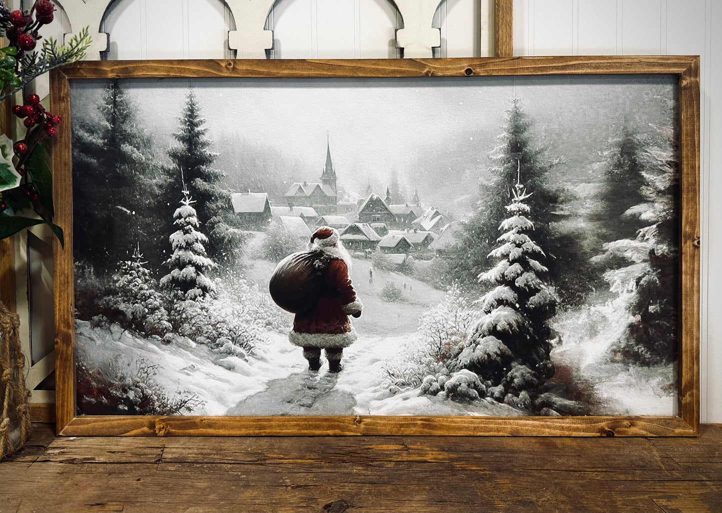 Santa looking over village snowy winter scene wood framed canvas Christmas print