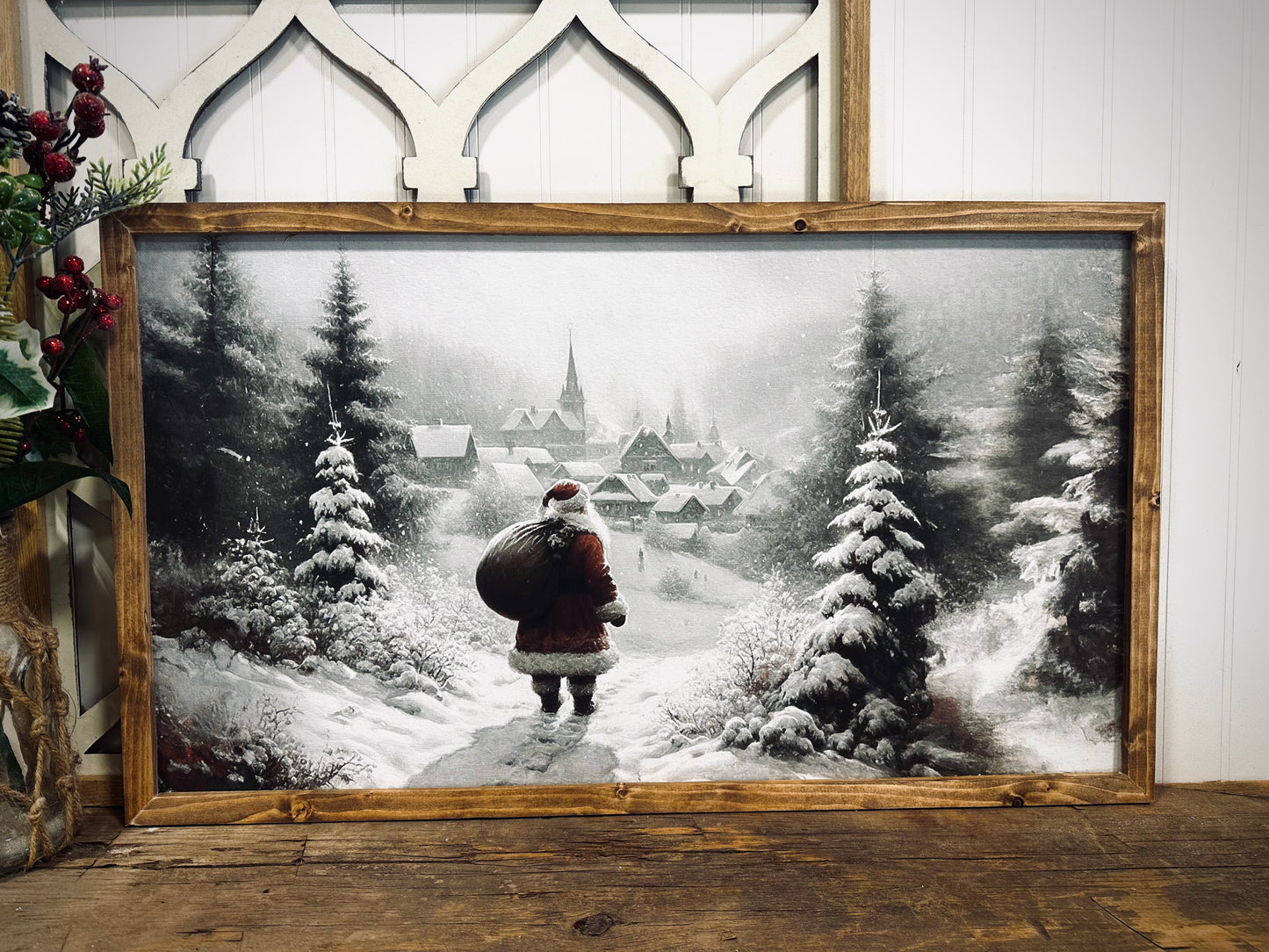 Santa looking over village snowy winter scene wood framed canvas Christmas print