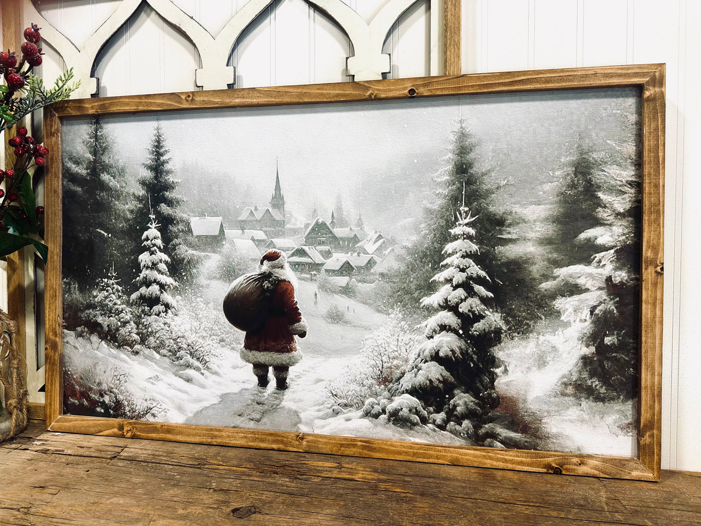 Santa looking over village snowy winter scene wood framed canvas Christmas print