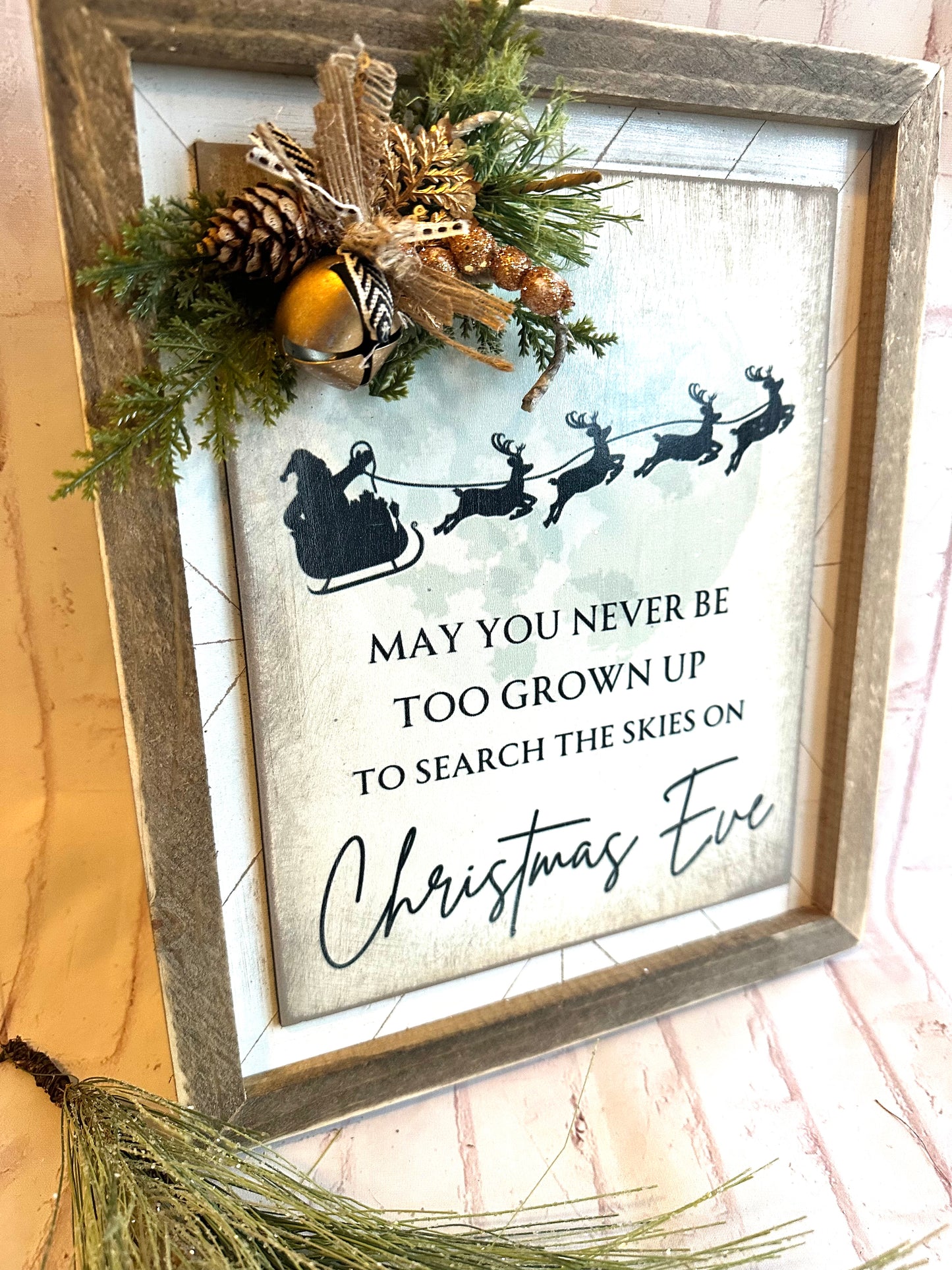 May you never be to grown up to search the skies on Christmas Eve distressed wood sign