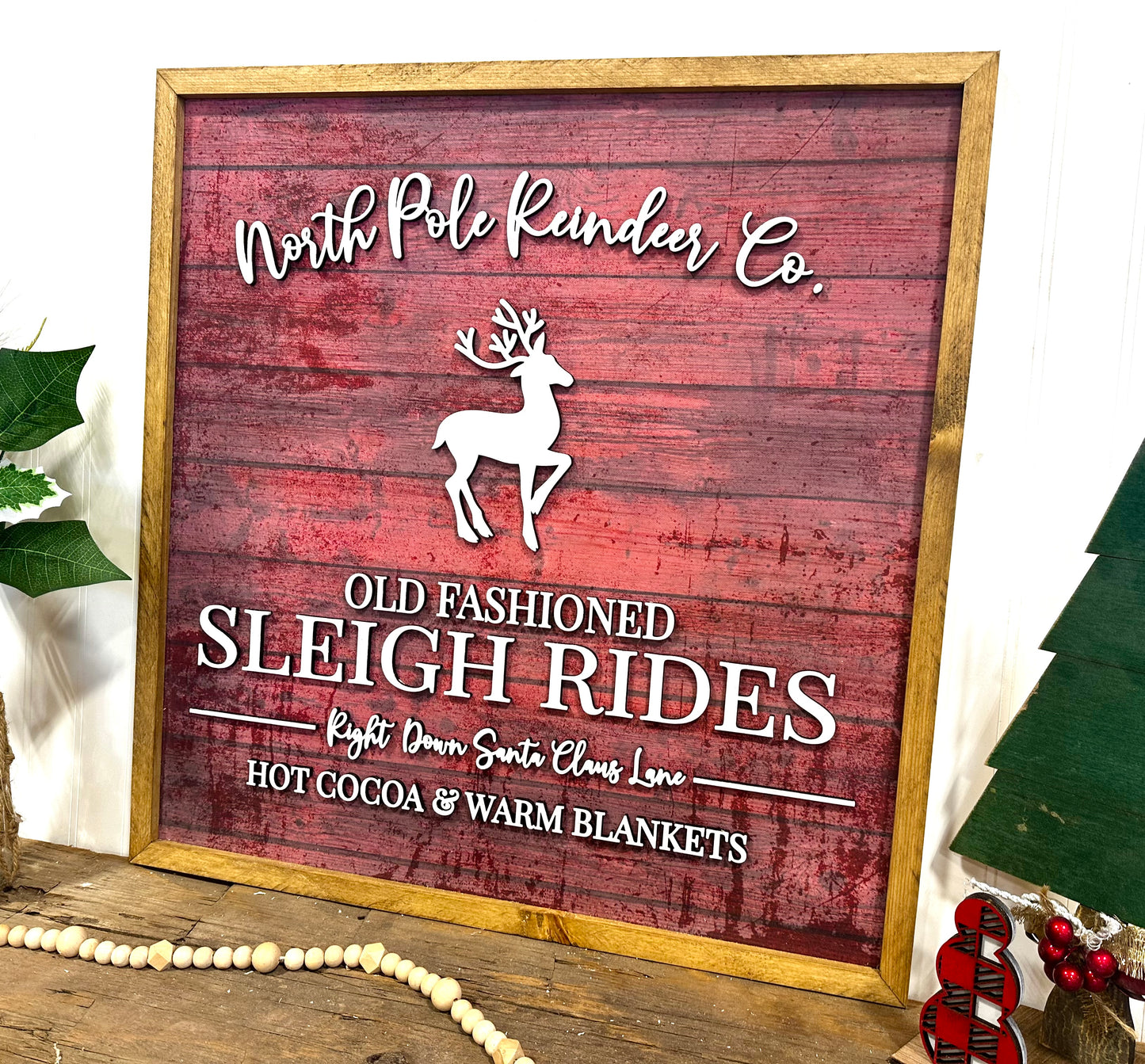 North Pole Reindeer Co wood framed sign