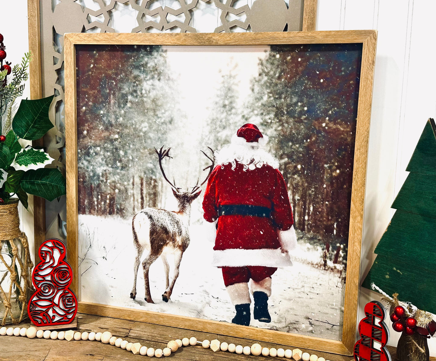 Santa walking with reindeer wood framed canvas print