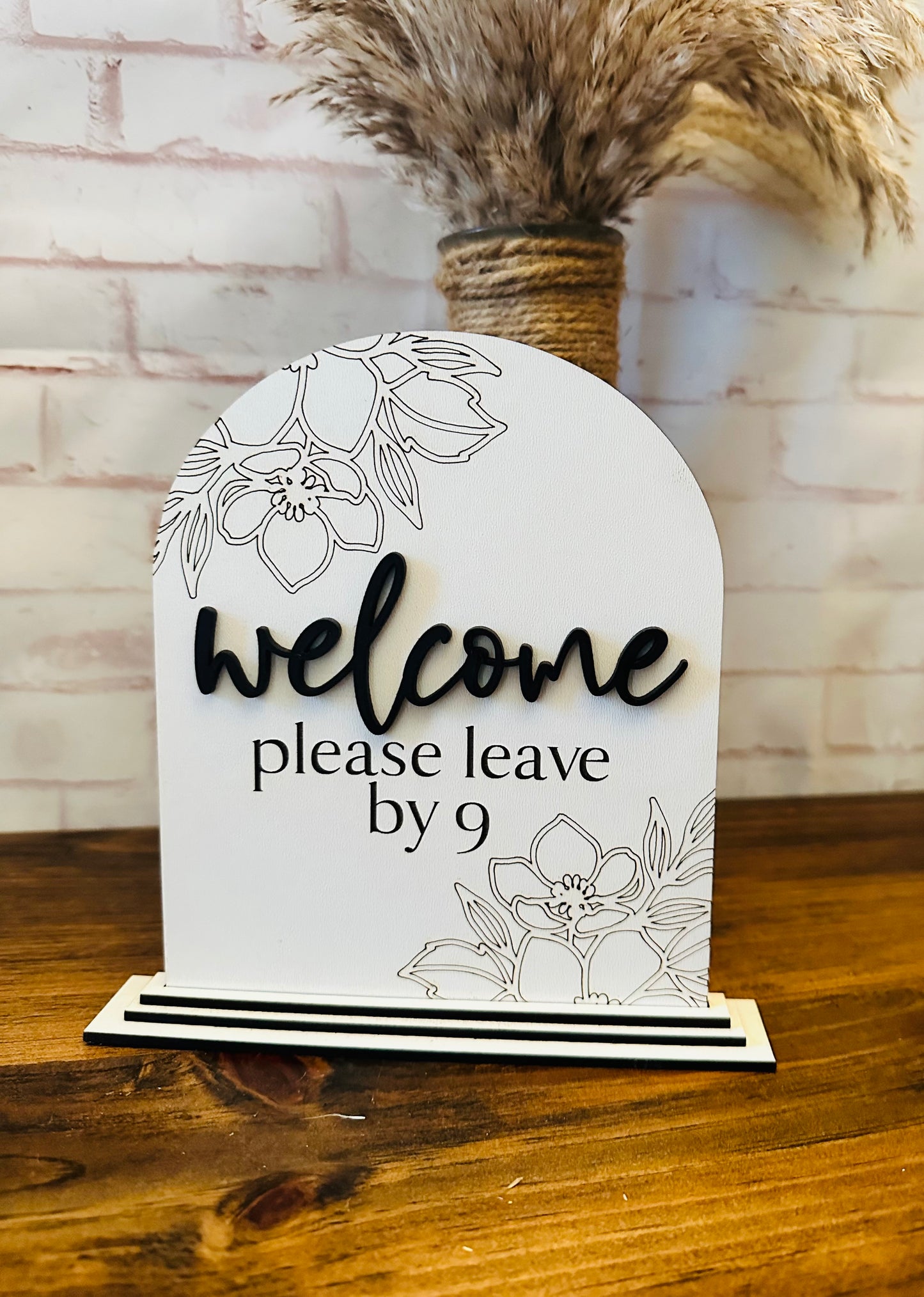 Welcome please leave by nine sign