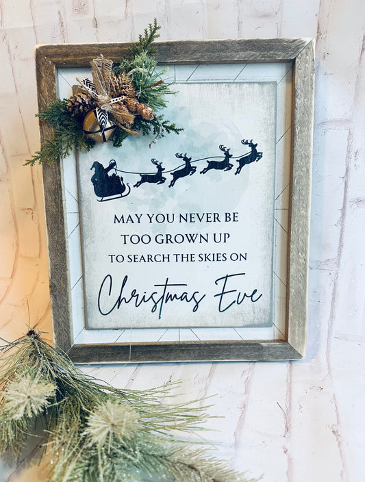 May you never be to grown up to search the skies on Christmas Eve distressed wood sign