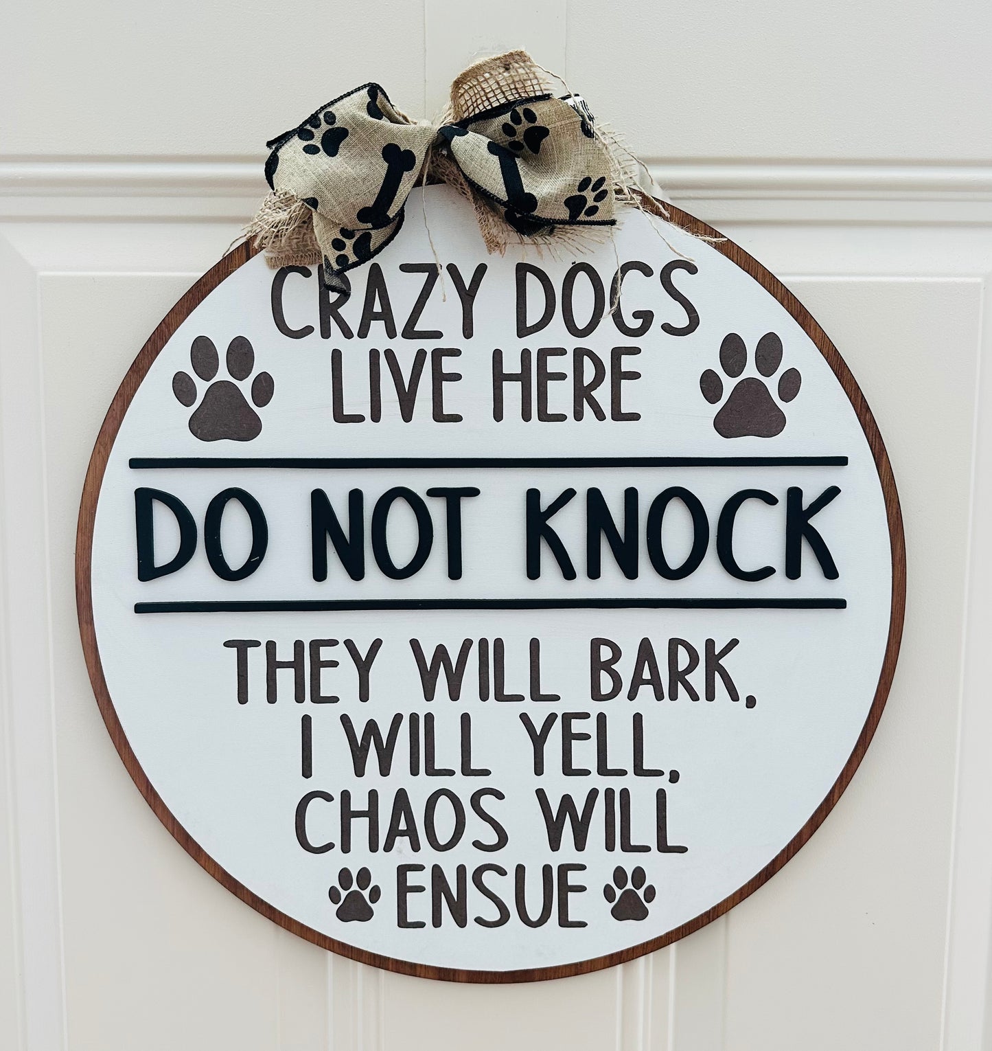 Crazy dogs live here doorhanger