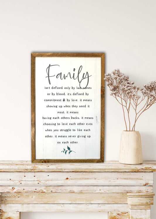 Family isn’t defined only by last name or by blood farmhouse wood sign