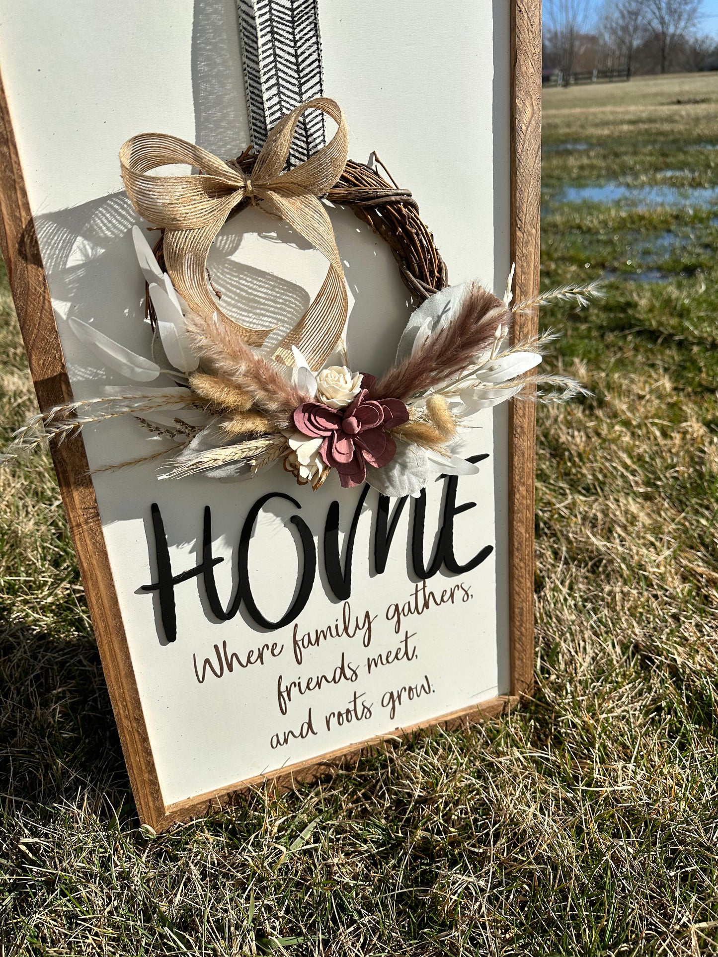 Home where family gathers friends meet and roots grow farmhouse sign