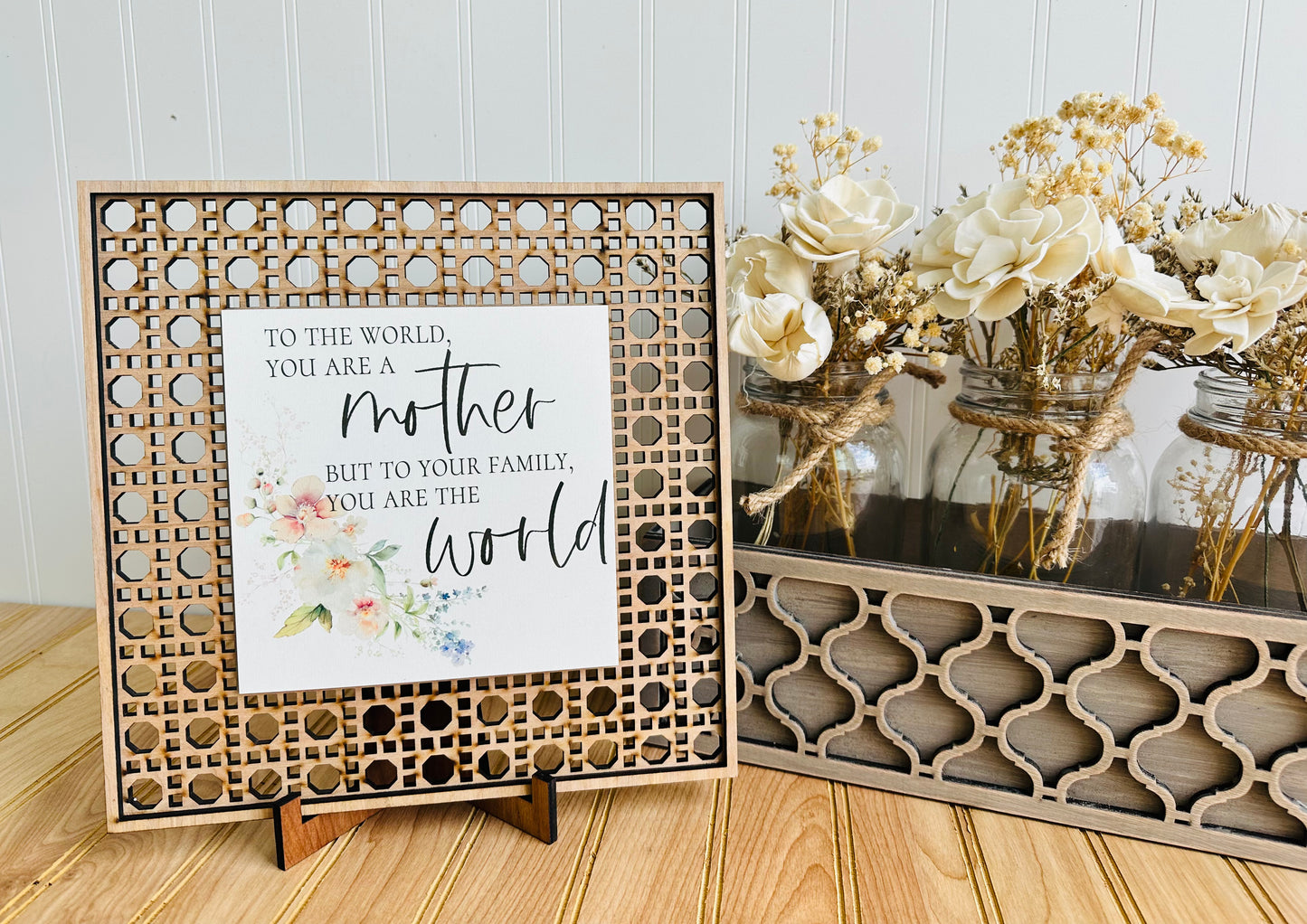 To the world you are a mother but to your family you are the world rattan table top sign