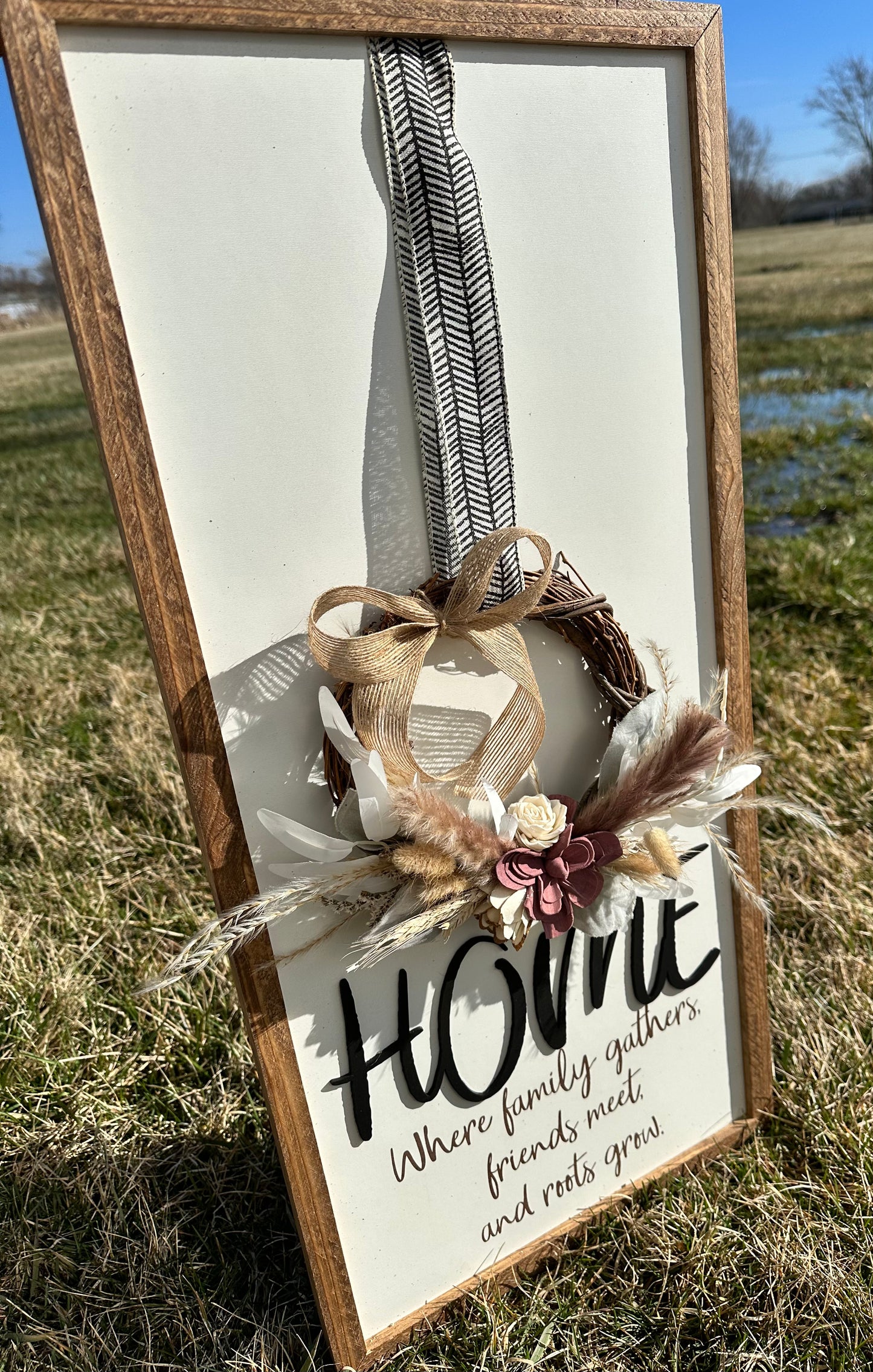 Home where family gathers friends meet and roots grow farmhouse sign